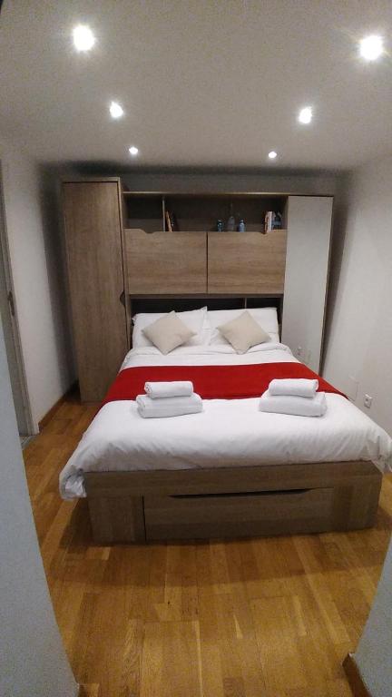 a bedroom with a large bed with two towels on it at Villa Azur Cap d'Ail in Cap d'Ail