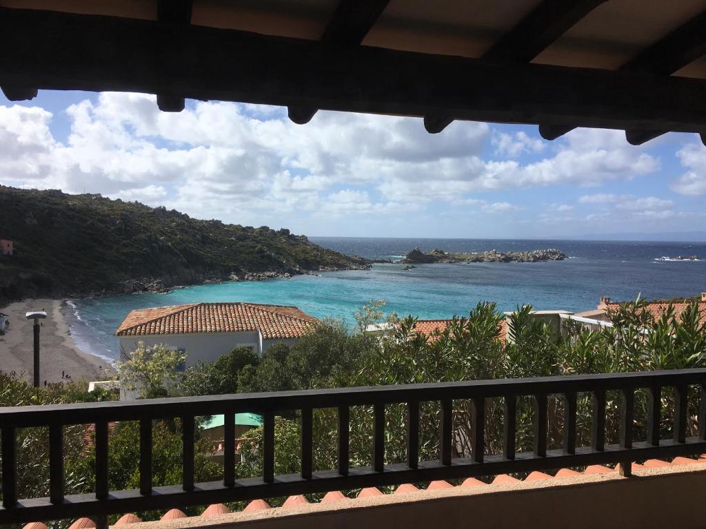 a view of the ocean from a balcony at Mare33 in Santa Teresa Gallura