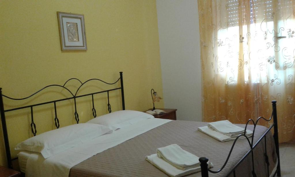 A bed or beds in a room at Perla del Salento