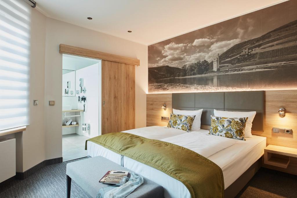 Postel nebo postele na pokoji v ubytování Hotel Rose