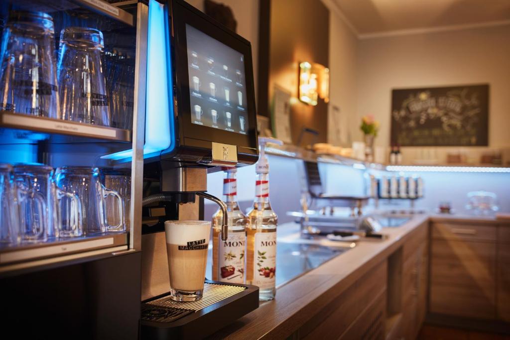 Kuchyň nebo kuchyňský kout v ubytování Hotel Rose