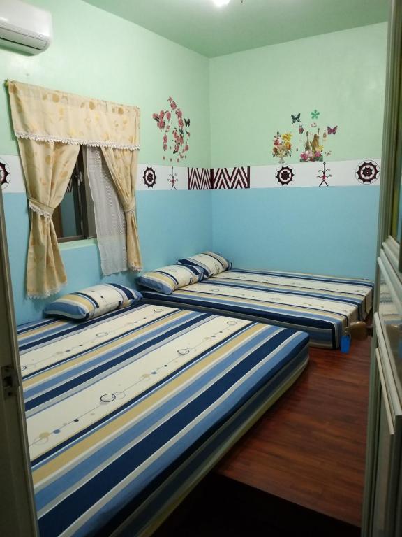 Postel nebo postele na pokoji v ubytování Fu Ya N B&B