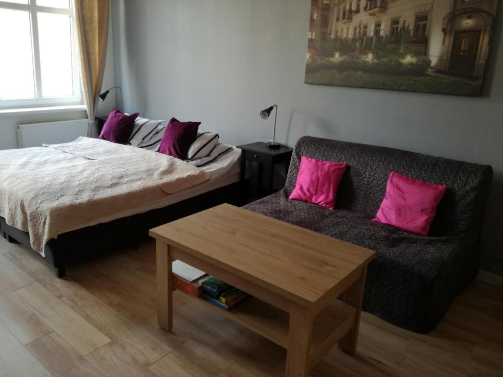 Posteľ alebo postele v izbe v ubytovaní Novitas Apartments