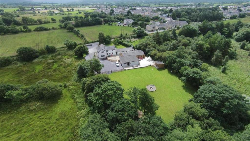 an aerial view of a large house on a green field at Llety'r Adar in Port Dinorwic