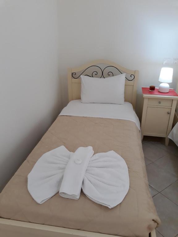 Postel nebo postele na pokoji v ubytování PULADES RESORT
