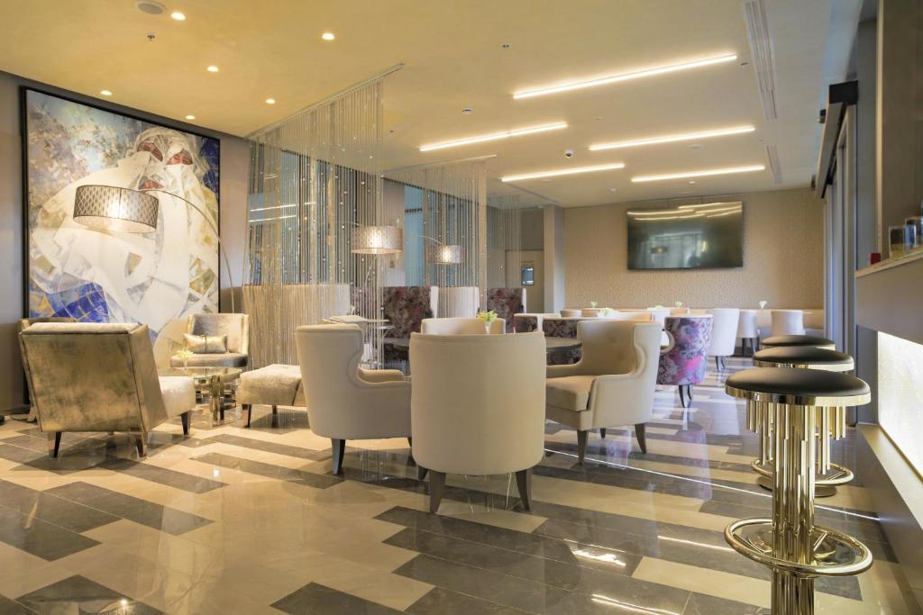 TV a/nebo společenská místnost v ubytování The Legacy Luxury Hotel, Algiers