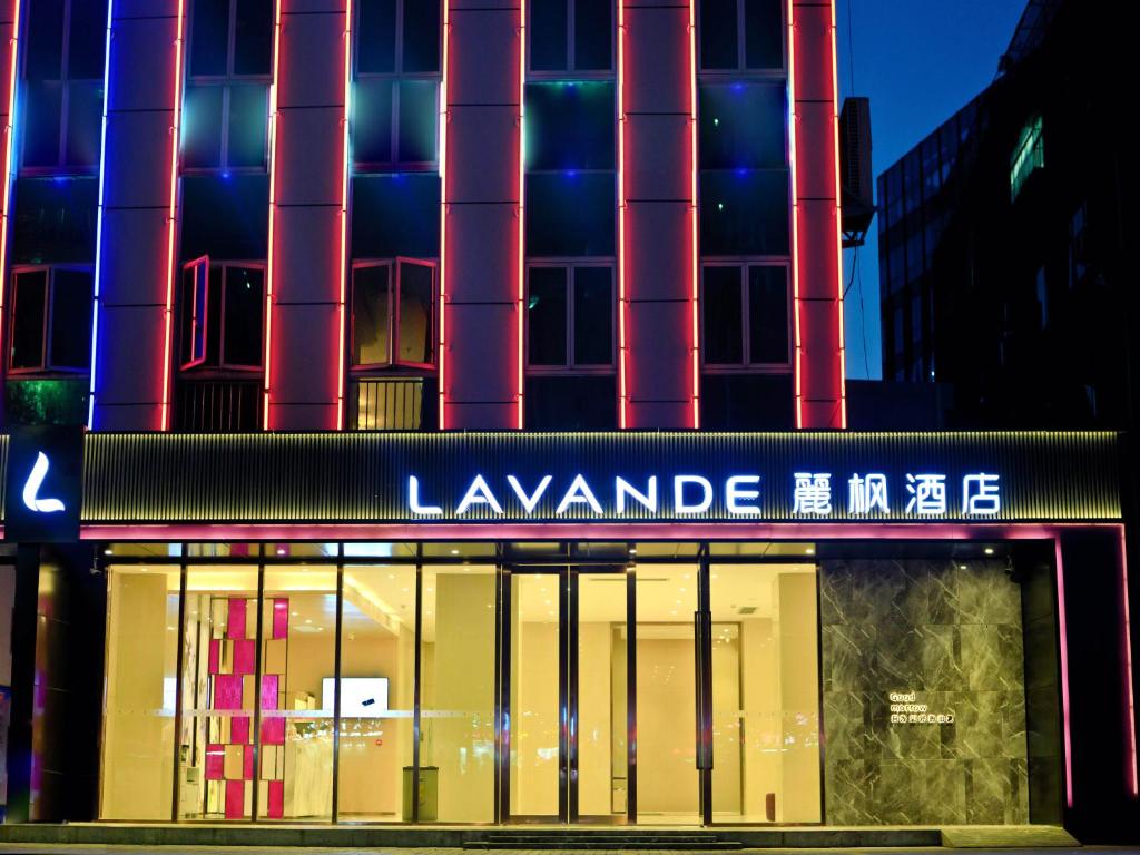 a building with a sign on the front of it at Lifeng Hotel (Huawei Base Store, Bantian, Shenzhen North Station) in Shenzhen