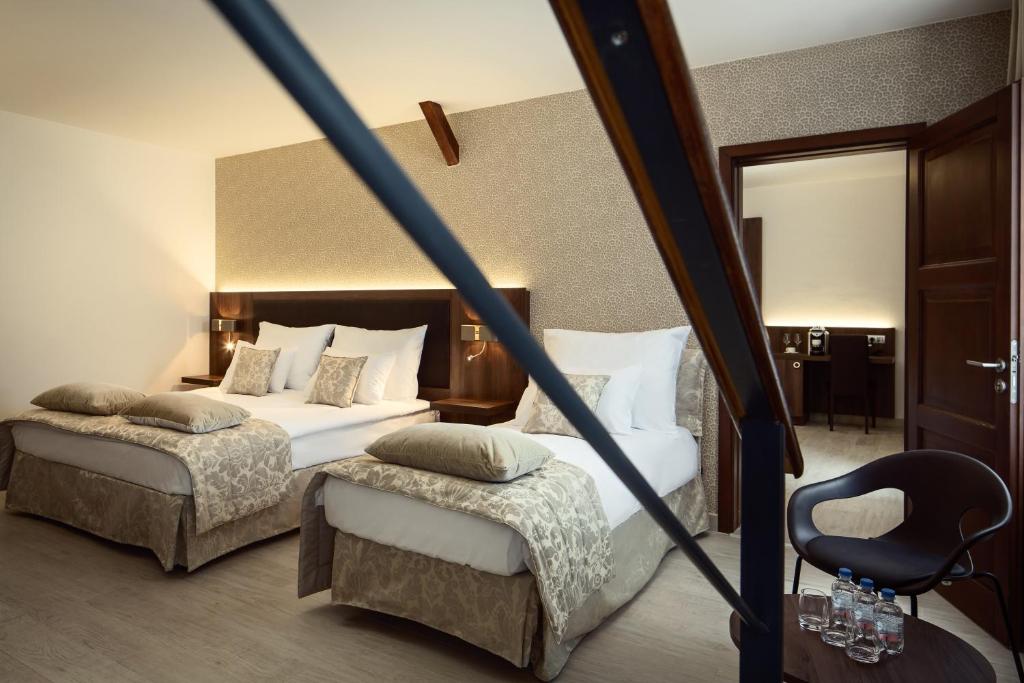 Postel nebo postele na pokoji v ubytování Michelangelo Grand Hotel