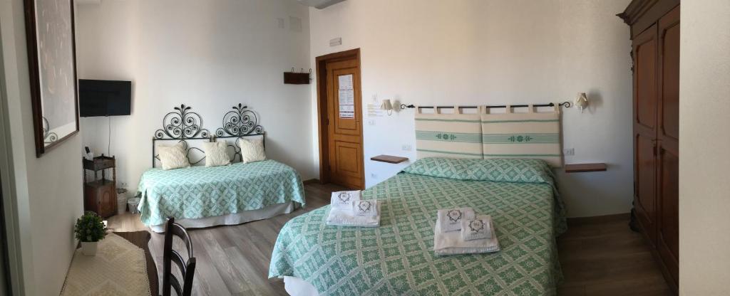 Postel nebo postele na pokoji v ubytování Su Corittu Guesthouse