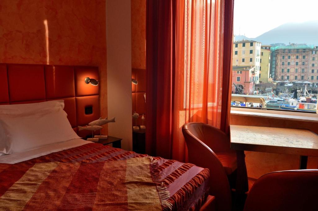Postel nebo postele na pokoji v ubytování I Tre Merli Locanda