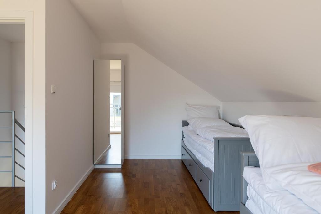 Posteľ alebo postele v izbe v ubytovaní Apartamenty.in Jastrzębia Góra
