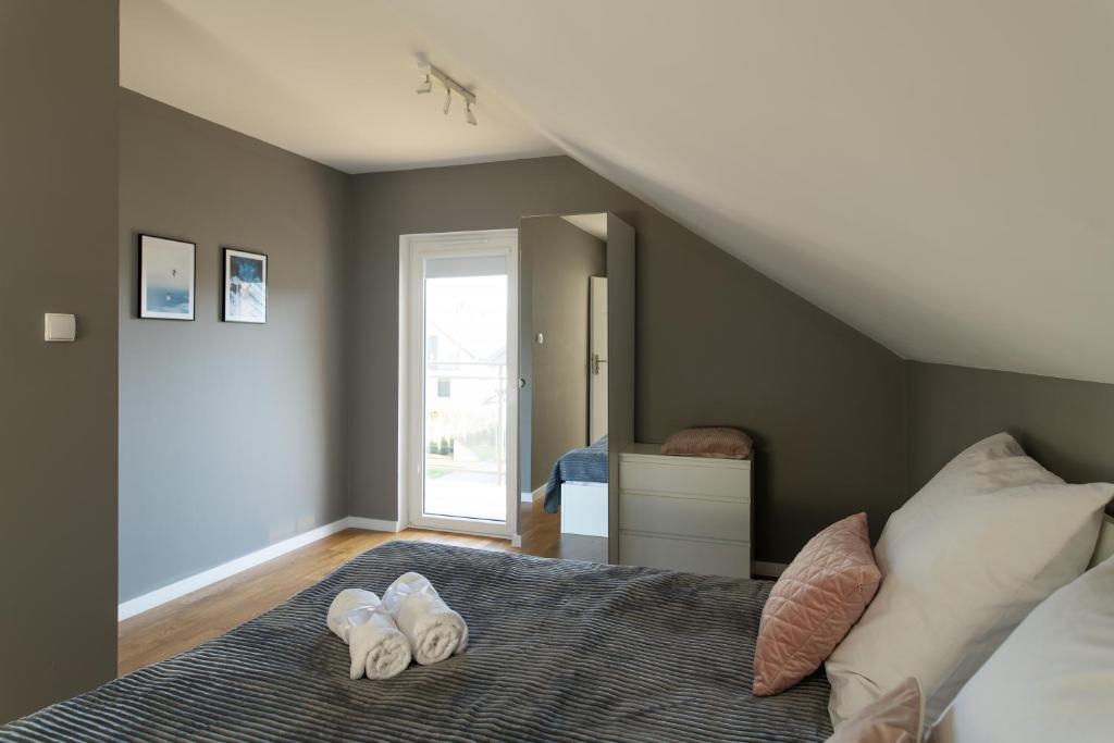 Posteľ alebo postele v izbe v ubytovaní Apartamenty.in Jastrzębia Góra