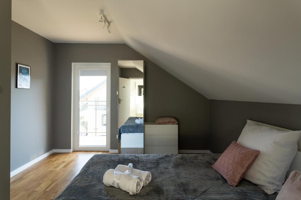 Posteľ alebo postele v izbe v ubytovaní Apartamenty.in Jastrzębia Góra
