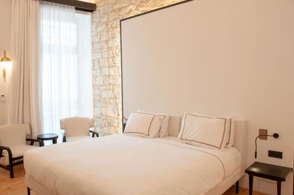 Postel nebo postele na pokoji v ubytování S Paul City Hotel