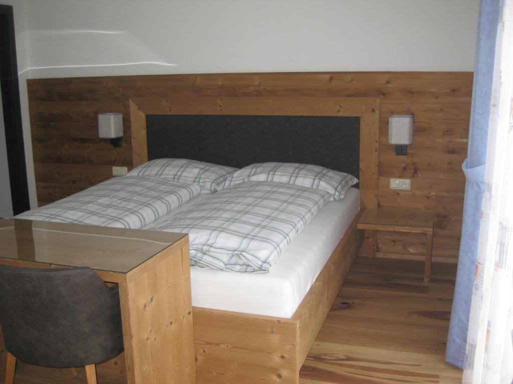 A bed or beds in a room at Ferienhaus Mendlingbauer