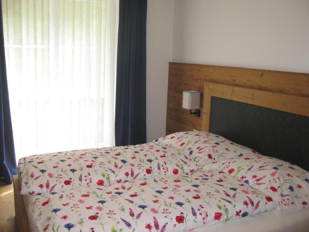 A bed or beds in a room at Ferienhaus Mendlingbauer