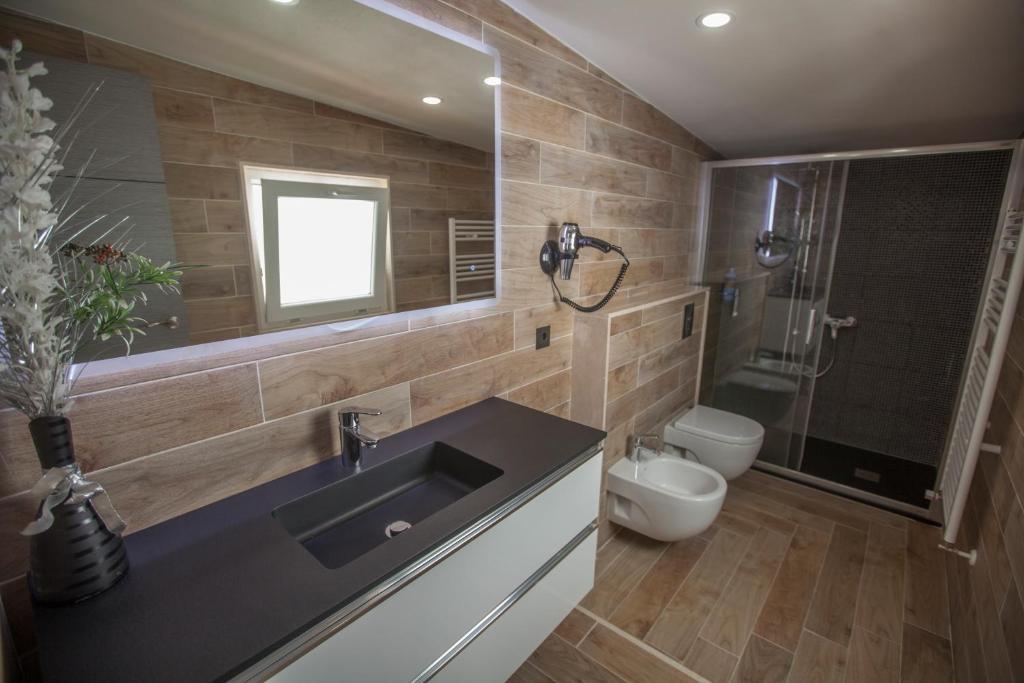 a bathroom with a sink and a toilet at Villa hortencia in Tarragona