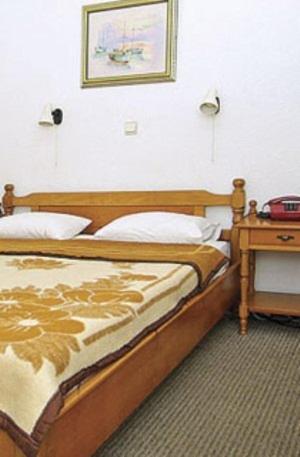 Postel nebo postele na pokoji v ubytování Hotel Helios