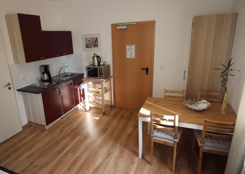 Kuchyň nebo kuchyňský kout v ubytování Apart Hotel Paradies