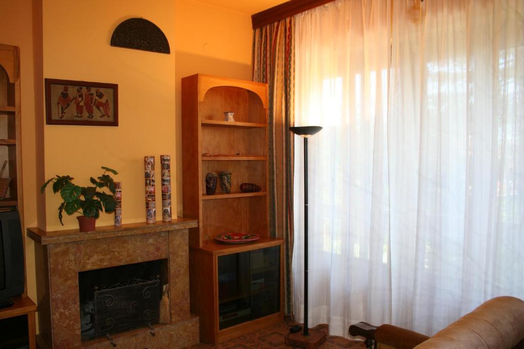 Televízia a/alebo spoločenská miestnosť v ubytovaní La casa di Rachele