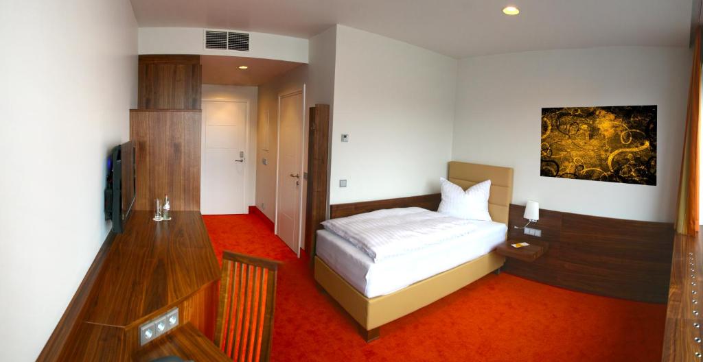 Postel nebo postele na pokoji v ubytování Business Hotel Ambio Gleisdorf