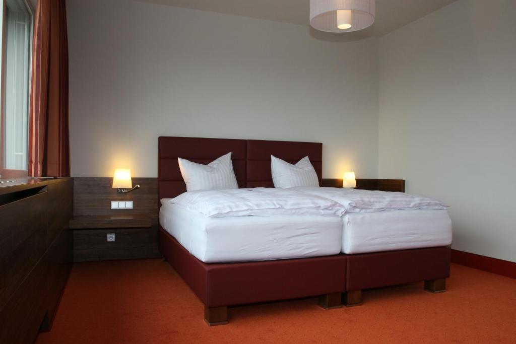 Postel nebo postele na pokoji v ubytování Business Hotel Ambio Gleisdorf