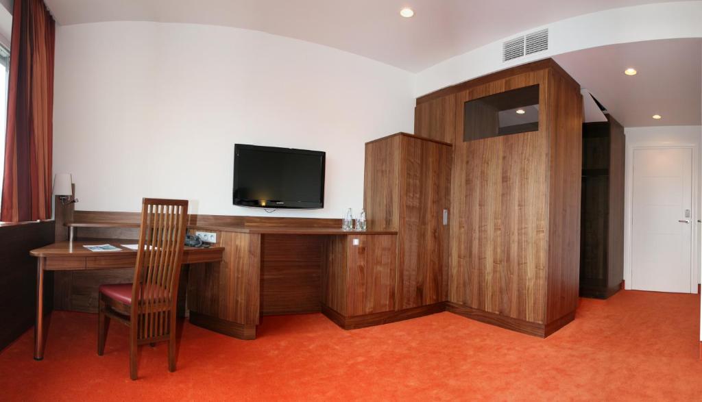 TV a/nebo společenská místnost v ubytování Business Hotel Ambio Gleisdorf
