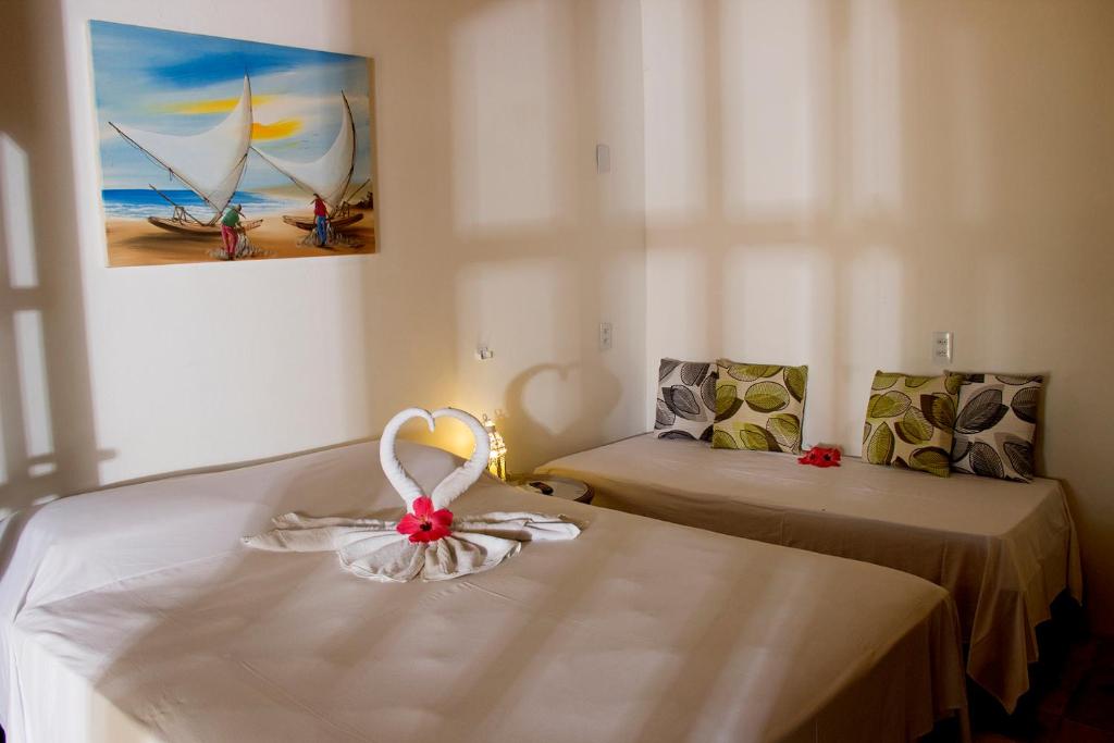 Cama ou camas em um quarto em Pousada Villa Caju