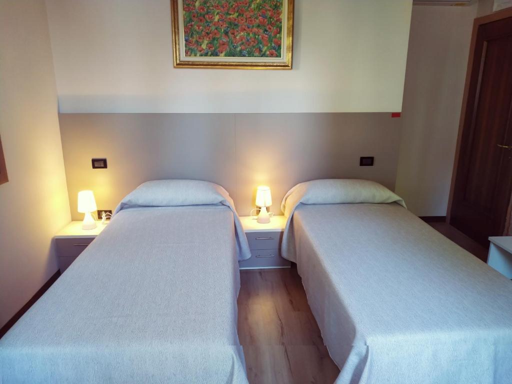 A bed or beds in a room at Agriturismo le Colonie