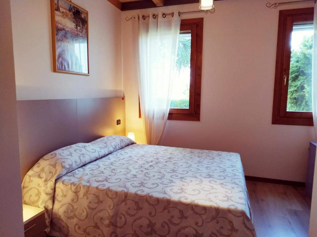 A bed or beds in a room at Agriturismo le Colonie