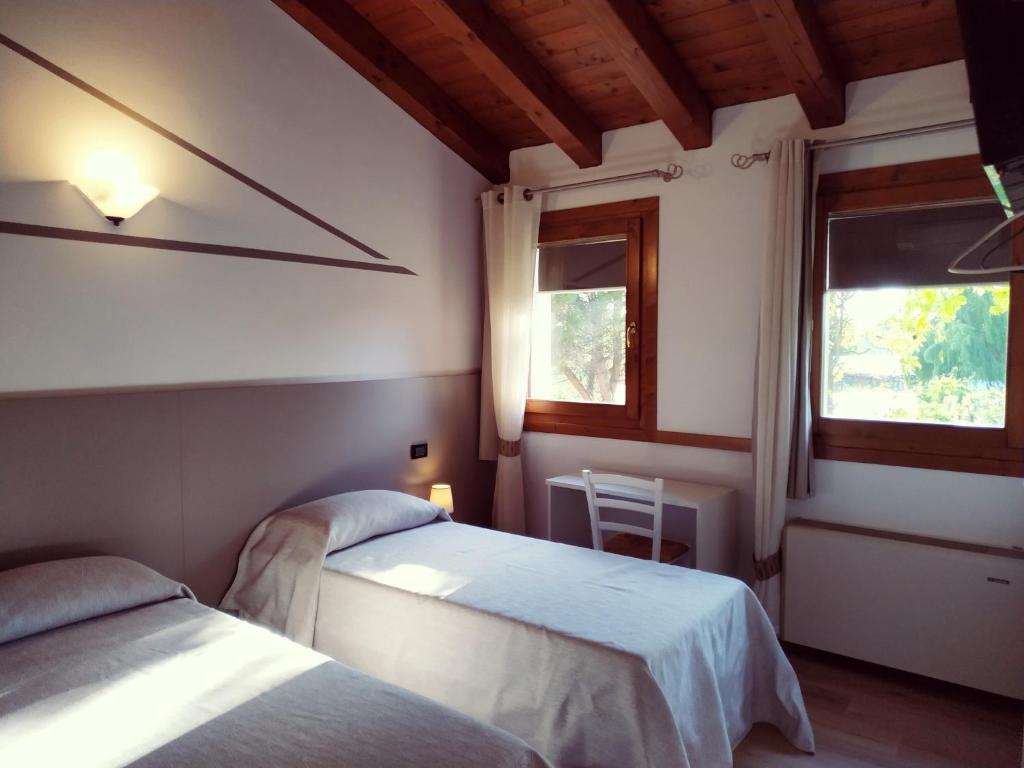 A bed or beds in a room at Agriturismo le Colonie