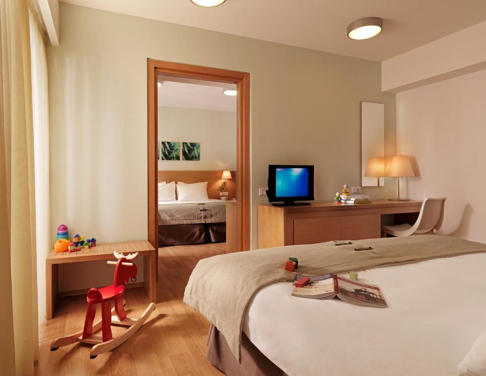 Postel nebo postele na pokoji v ubytování Elefsina Hotel