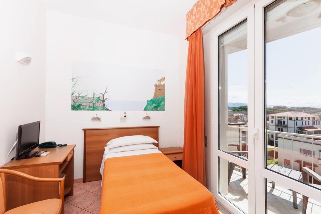 Postel nebo postele na pokoji v ubytování Hotel Ambasciatori