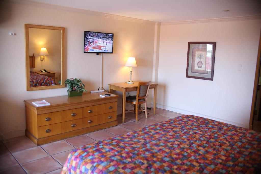 Postel nebo postele na pokoji v ubytování Heritage Hotel