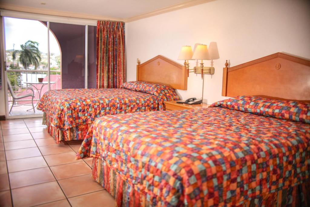 Postel nebo postele na pokoji v ubytování Heritage Hotel