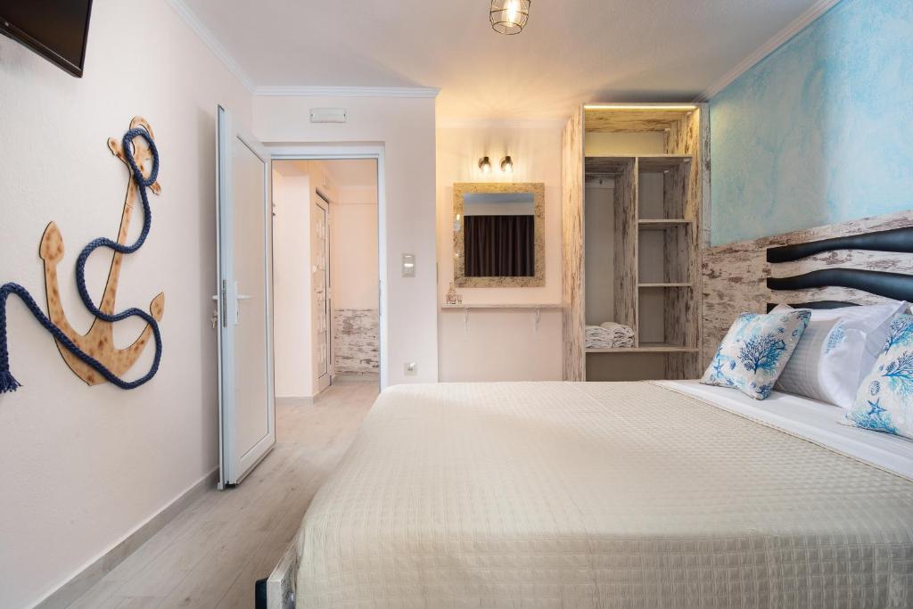 a bedroom with a large bed in a room at House Katerina Mediterranean in Sarti