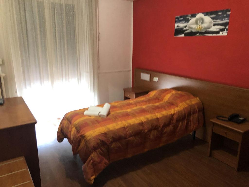Postel nebo postele na pokoji v ubytování Hotel Tre Monti