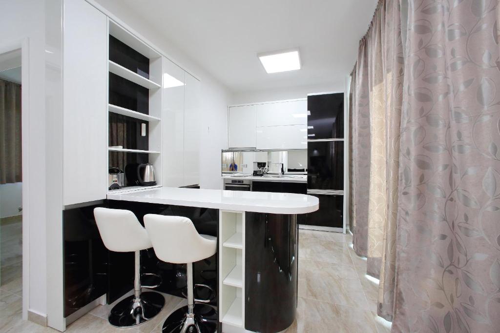 Kuchyň nebo kuchyňský kout v ubytování Apartments Dalmatia Infinity