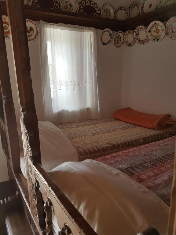 two bunk beds in a room with a window at Irene's House in Olympos