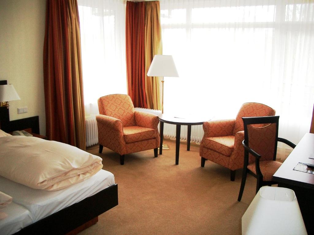 Postel nebo postele na pokoji v ubytování Hotel Hof Sudermühlen