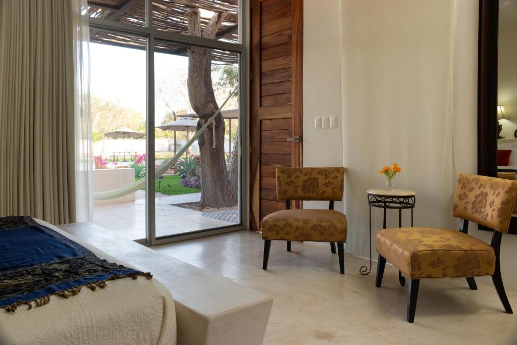 Posezení v ubytování Hotel Casa de Campo Conkal Merida