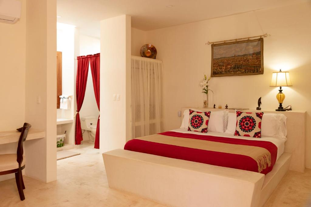 Postel nebo postele na pokoji v ubytování Hotel Casa de Campo Conkal Merida