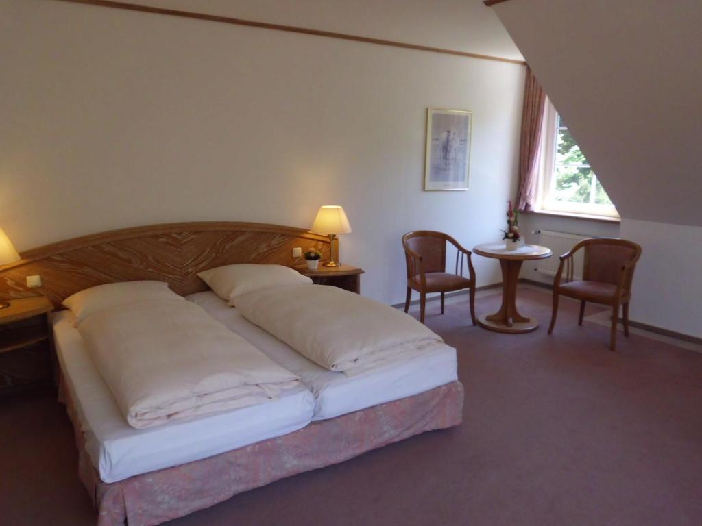 Postel nebo postele na pokoji v ubytování Hotel Hof Sudermühlen