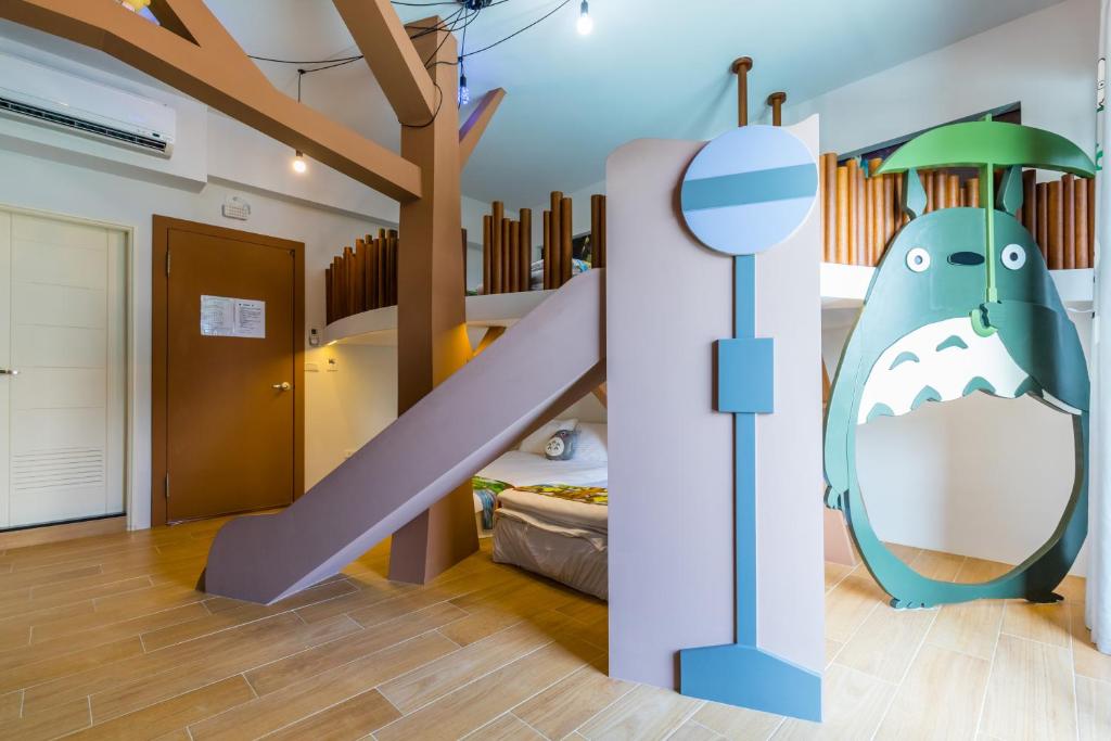 Postel nebo postele na pokoji v ubytování 松楓親子民宿Songfeng Family B&B