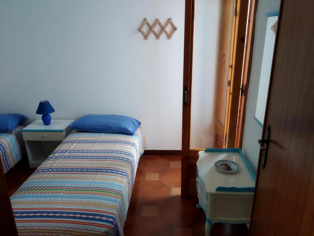 Postel nebo postele na pokoji v ubytování mare profumo di mare