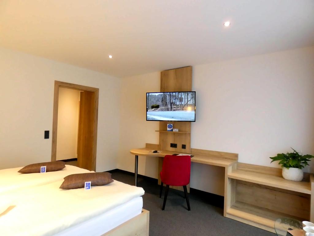 TV a/nebo společenská místnost v ubytování Akzent Hotel Cordes & Restaurant am Rosengarten