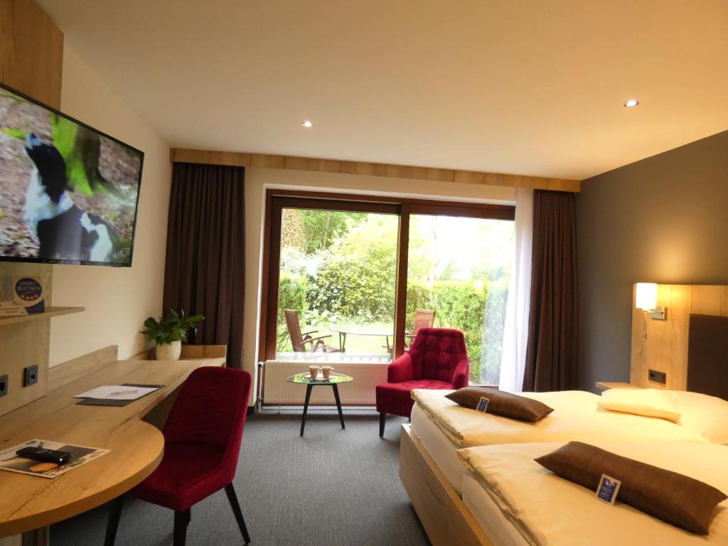TV a/nebo společenská místnost v ubytování Akzent Hotel Cordes & Restaurant am Rosengarten