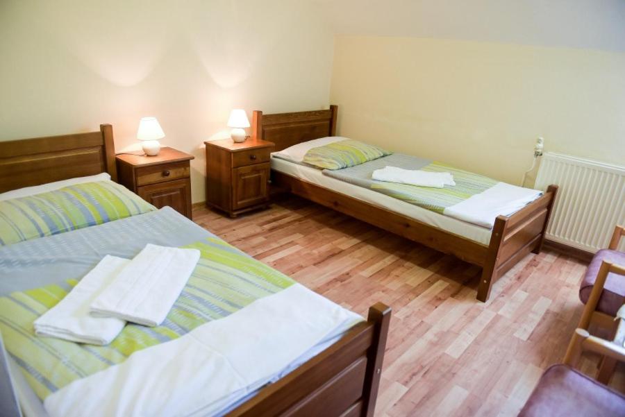 Postel nebo postele na pokoji v ubytování Hotel Rubín