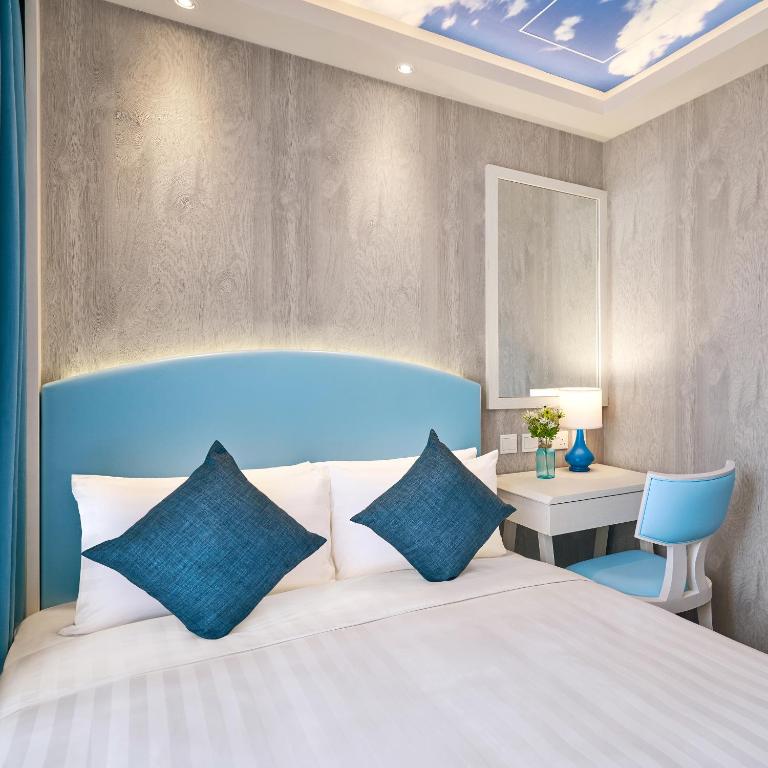 Postel nebo postele na pokoji v ubytování Hotel COZi Resort Tuen Mun