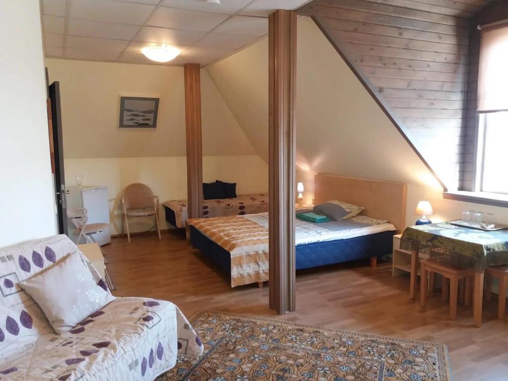Postel nebo postele na pokoji v ubytování Sunrise majutus